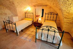 A bed or beds in a room at Maison MilleOttocento
