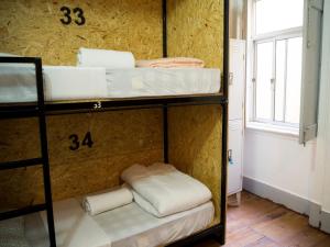 A bunk bed or bunk beds in a room at Aykibom Hostel