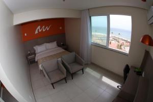 Cama ou camas em um quarto em Real Classic Bahia Hotel