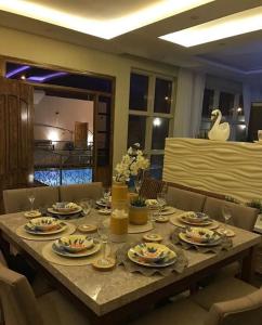 Restoran või mõni muu söögikoht majutusasutuses شالية النخلة