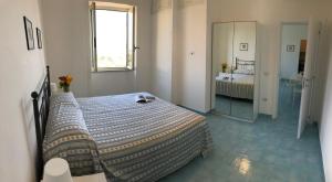A bed or beds in a room at Dolce Vista Apartment Amalfi Coast