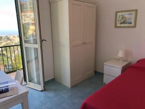 A bed or beds in a room at Dolce Vista Apartment Amalfi Coast