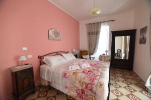 Postel nebo postele na pokoji v ubytování B&B" del Castello"