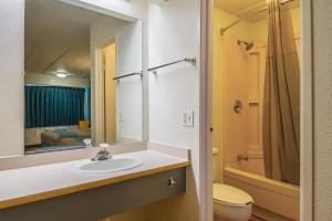 a bathroom with a sink and a toilet and a mirror at Motel 6-Knoxville, TN - North in Knoxville +52 photos