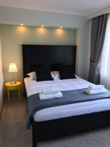 Säng eller sängar i ett rum på Luxury City Centre Apartment