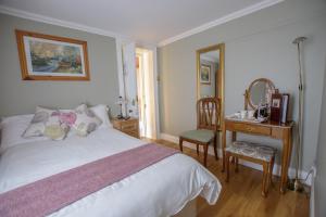 Ένα ή περισσότερα κρεβάτια σε δωμάτιο στο Brennan's Accommodation Glenties