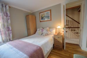 Ένα ή περισσότερα κρεβάτια σε δωμάτιο στο Brennan's Accommodation Glenties