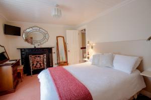 Ένα ή περισσότερα κρεβάτια σε δωμάτιο στο Brennan's Accommodation Glenties