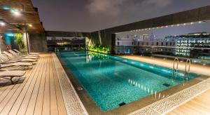 a swimming pool on the roof of a building at 30 Bencoolen in Singapore