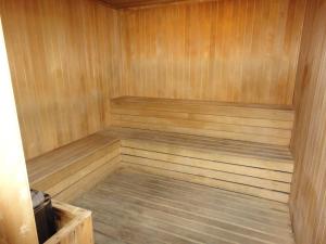 a wooden sauna with a wooden floor and a wooden at FnF Suite @ Time Square in Kuala Lumpur