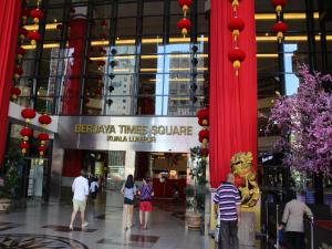 a group of people walking in a shopping mall at FnF Suite @ Time Square in Kuala Lumpur