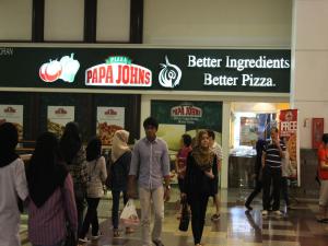 a group of people walking in a shopping mall at FnF Suite @ Time Square in Kuala Lumpur