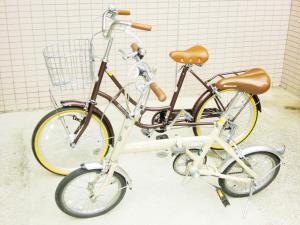 two bikes are parked next to each other at Hotel Park Avenue in Tokyo