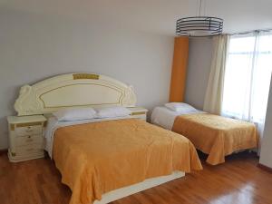 Posteľ alebo postele v izbe v ubytovaní Le Prince Apart Tacna