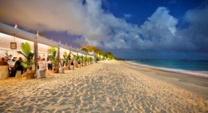 a white sandy beach with a restaurant and the ocean at Noosa Beach Apartment on HASTING ST French quarter resort.Noosa Heads in Noosa Heads