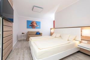 Postel nebo postele na pokoji v ubytování Hotel Tiek Superior