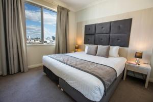 Ένα ή περισσότερα κρεβάτια σε δωμάτιο στο Zappeion Apartments