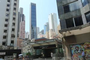 a building in a city with tall buildings at WE Hotel in Hong Kong