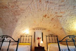 A bed or beds in a room at Maison MilleOttocento