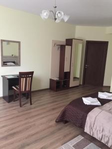Postel nebo postele na pokoji v ubytování Hotel Karpaty