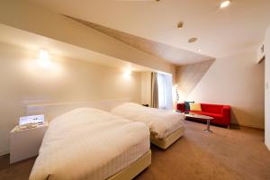 Кровать или кровати в номере Hotel Annex