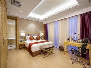 מיטה או מיטות בחדר ב-Ariva Tianjin Zhongbei Hotel & Serviced Apartment
