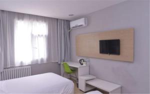 Tempat tidur dalam kamar di Motel Ji'nan Shandong University Shanda Road