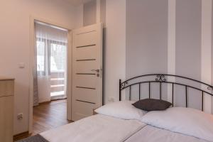 Lova arba lovos apgyvendinimo įstaigoje udanypobyt Apartament Skocznia