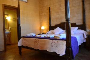 Postel nebo postele na pokoji v ubytování Agroturismo Es Gallicant