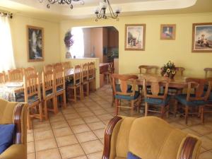 a dining room with a table and chairs at Casa Akay in Zorita