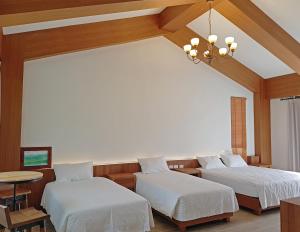 Postel nebo postele na pokoji v ubytování Taroko Formosa Homestay