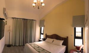 Postel nebo postele na pokoji v ubytování Taroko Formosa Homestay