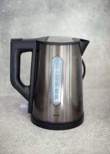 a black and silver tea kettle sitting on a counter at Apartments M&L in Vodice