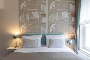 Letto o letti in una camera di Hotel 'T Sandt
