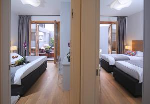 Postel nebo postele na pokoji v ubytování Luxury Apartment Kampanel + 37 fotografií