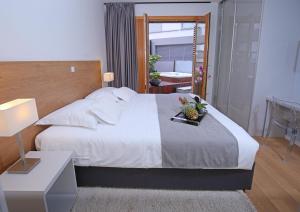 Postel nebo postele na pokoji v ubytování Luxury Apartment Kampanel