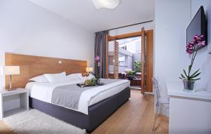 Postel nebo postele na pokoji v ubytování Luxury Apartment Kampanel