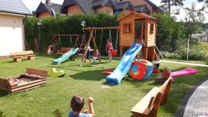 a group of children playing on a playground at Liwia in Niechorze