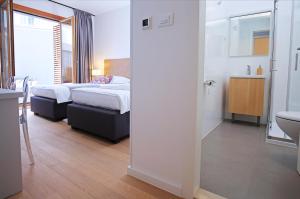 Postel nebo postele na pokoji v ubytování Luxury Apartment Kampanel