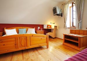 Postel nebo postele na pokoji v ubytování Weingut Winzerhof Gästezimmer Grebenz