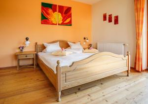 Postel nebo postele na pokoji v ubytování Weingut Winzerhof Gästezimmer Grebenz
