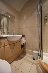 a bathroom with a sink and a shower at The Haven in Windermere