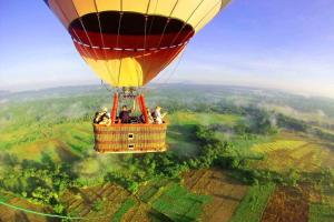 a group of people riding a hot air balloon at Sisira Homestay - Sigiriya in Sigiriya