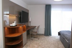 TV a/nebo společenská místnost v ubytování Hotel Petersen