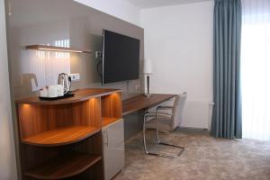 TV a/nebo společenská místnost v ubytování Hotel Petersen