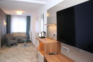 TV a/nebo společenská místnost v ubytování Hotel Petersen