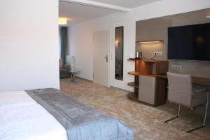 TV a/nebo společenská místnost v ubytování Hotel Petersen