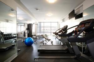 a gym with tread machines and a blue ball at Casa Andina Select Moquegua in Moquegua