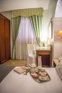 Postel nebo postele na pokoji v ubytování Palmed Hotel