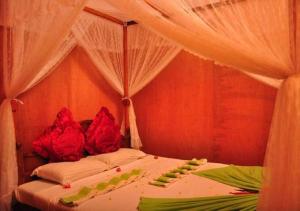Voodi või voodid majutusasutuse Sigiri Aliya Tree house toas